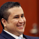 George Zimmerman laughs during a humorous moment as his defense counsel Mark O'Mara questions potential jurors June 20, 2013, for his trial in Sanford, Fla., on charges in the fatal shooting of Trayvon Martin.
Gary W. Green-Pool/Getty Images